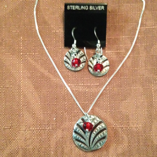 Silver pieces accented with Red Czech glass beads.