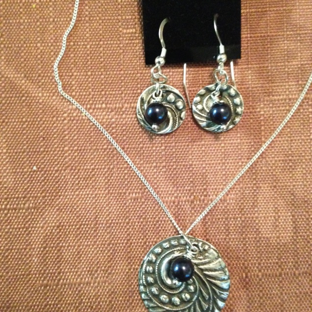 Silver pieces accented with Navy blue Swarovski Pearls.i